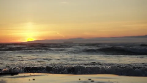 Ocean Sunset Waves Reflecting on Wet Sand Shore Stock Footage 313635346