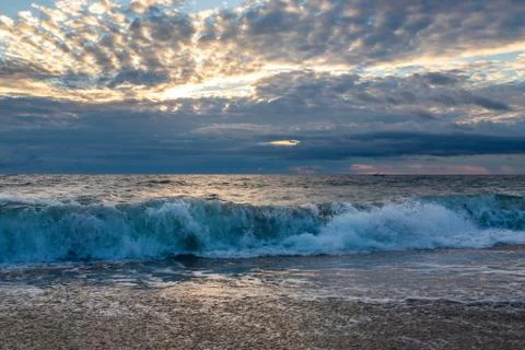 Ocean surf on the sandy beach Stock Photos