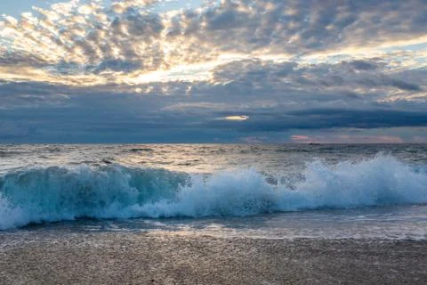 Ocean surf on the sandy beach Stock Photos