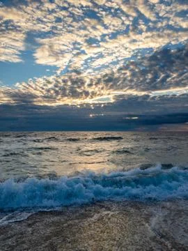 Ocean surf on the sandy beach Stock Photos
