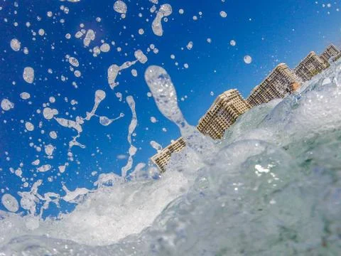 Ocean surf at sandy beach Stock Photos
