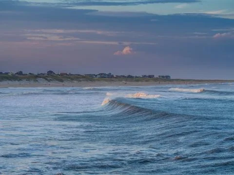 Ocean surf at sandy beach Stock Photos