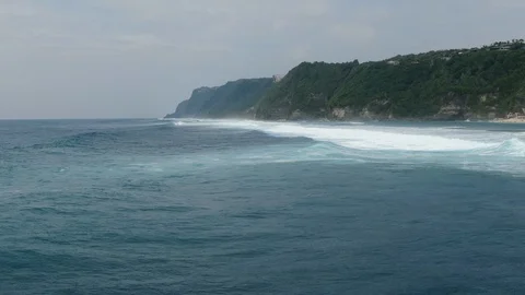 Ocean surf waves at high tide in Indonesia, Bali. Drone shooting Stock Footage 125794643