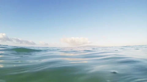 Ocean surface, half under half over slow motion video Stock Footage
