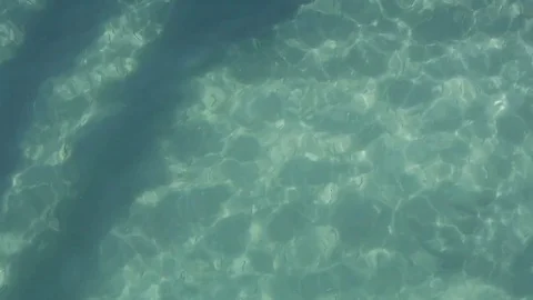 Ocean Surface shadow reflection of pier Stock Footage 84280052