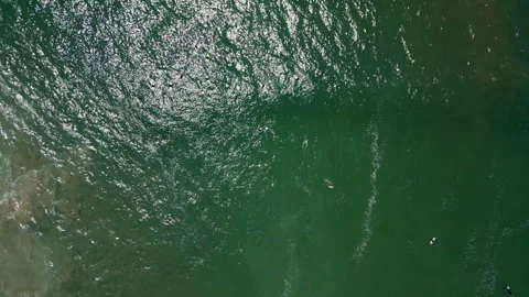 Ocean with Surfers Pull Up Aerial 動画素材 241202771