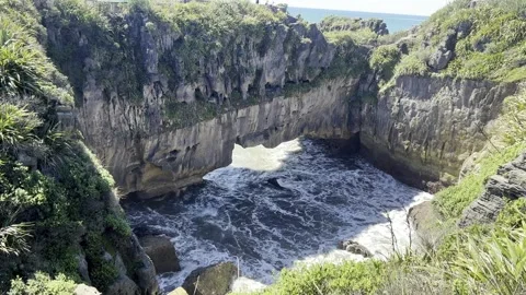 Ocean surging through a rock chasm (Slow Motion) Stock Footage 344232165