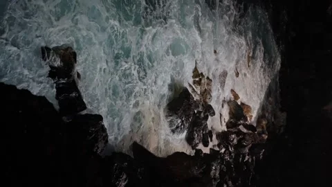 Ocean surrounded by rocky marine landforms. Unique natural landscape in the dark Stock Footage 266797853