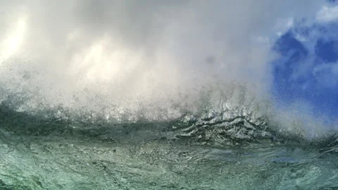 Ocean Swell Surging Beneath Towering White Clouds and Blue Sky Stock Footage 344388839
