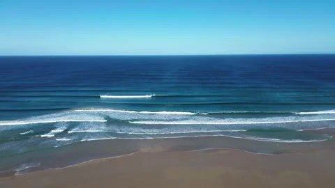 Ocean Swells Rolling Toward Remote Sandy Shoreline Video stock 334836340