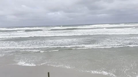 Ocean tide on overcast day Stock Footage 242885355