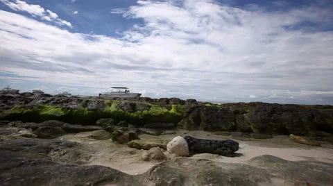 Ocean tide waves washing over rocky shore Stock Footage 36563423