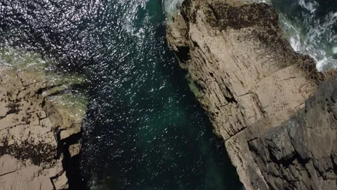 Ocean Top Down Flyover. Tintagel on Cornwall coast. 動画素材 155026178