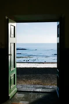 Ocean trough the door Stock Photos