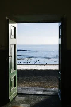 Ocean trough the door Stock Photos
