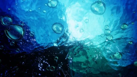 Ocean underwater air bubbles rise up to the colorful wavy surface Stock Footage 246788354