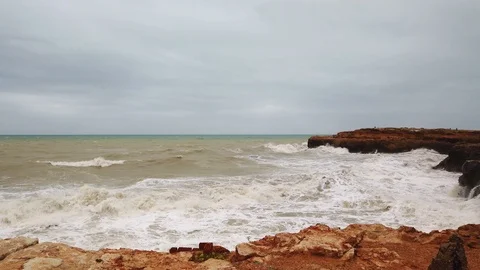 Ocean very big wave foam sea spray. Powerful waves washing over dangerous rocky Stock Footage 122244739