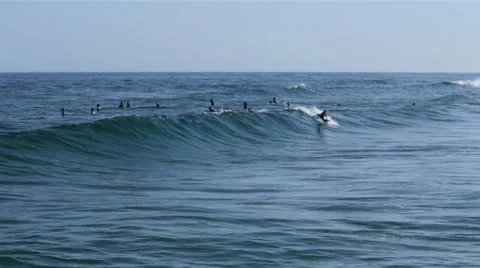 Ocean view and Surfers crowd in Tavira Island coast beach Stock Footage 51120184