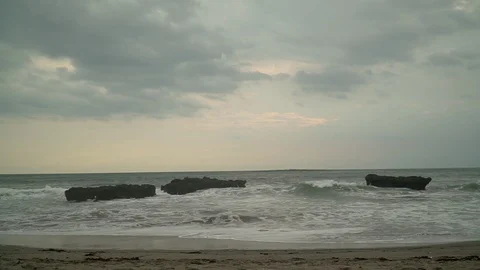 Ocean view and waves breaking on stones and rocks Stock Footage 126973545