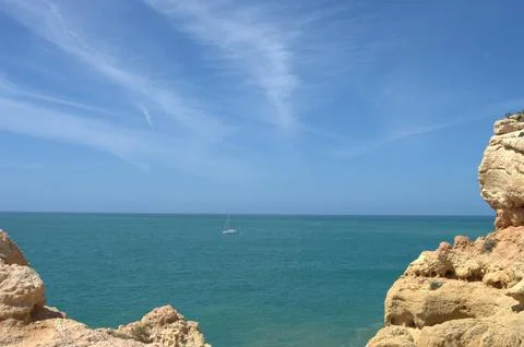 Ocean view between rocky cliffs Stock Photos