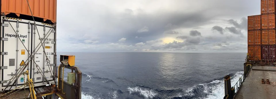 Ocean View Between Shipping Containers on Cargo Vessel at Sea Stock Photos