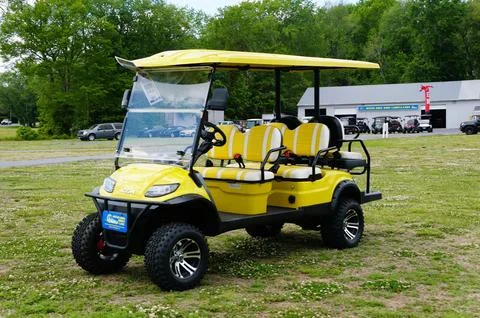 Ocean View, Delaware, U.S.A - July 1, 2026 - Bright yellow four-seat Icon i.. Stock Photos