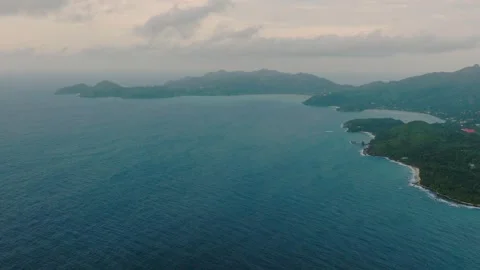 Ocean view with distant islands and green coastal mountains. Seychelles, Mahe. Stock Footage 318974443