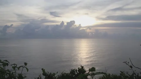 Ocean view at Karang Boma cliffs bathed in the glow of the sunset Stock Footage 231017222