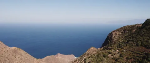 Ocean view with mountains in the foreground Stock Footage 202266857