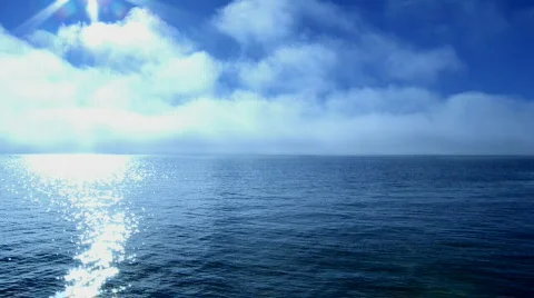 Ocean view over blue sky Stock Footage