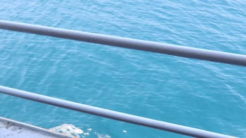 Ocean View from a Ship's Railing, Blue Water  Stock Footage 303719109