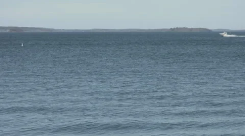 Ocean view with small boat crossing frame Video stock 62441360