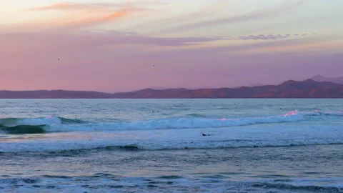 Ocean view at sunset, mountains and cloudy sky on background. Morro Bay, CA Stock Footage 147919995
