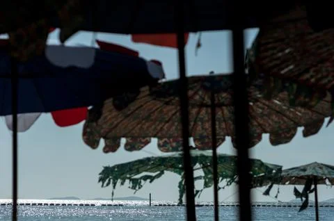 Ocean view through umbrellas Stock-Fotos