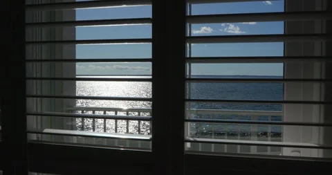 Ocean View through Window Slats During Evening Vídeo Stock 119002173