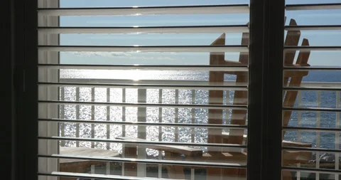 Ocean View through Window Slats During Evening with Chair Vídeo Stock 119002309