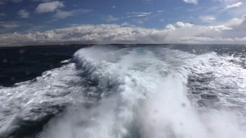 Ocean view of turbulent waters behind speed boat in the Straits of Magellan. Video stock 103370096