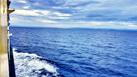 Ocean Wake Trail Behind Moving Ferry on Open Sea Stock Footage 335921125