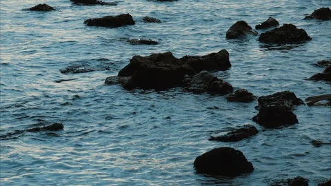 Ocean washes up on rocks Stock Footage 124852607