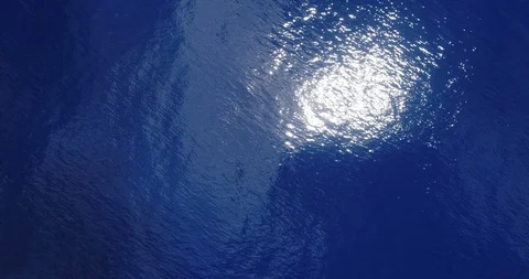 Ocean Water And Amazing Sun Light Reflecting In Blue Sea - Aerial drone top view Stock Footage