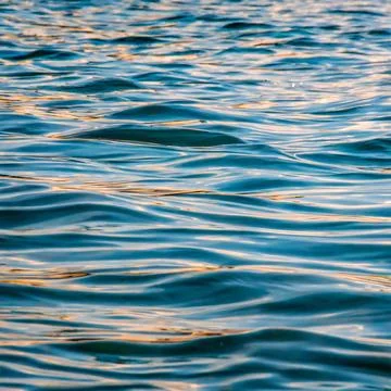 Ocean water background abstract background of seawater flow under light exposure Stock Photos