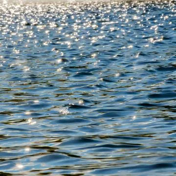 Ocean water background abstract background of seawater flow under light exposure Stock Photos