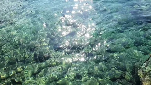 Ocean Water clear with Sun reflections Stock Footage 219821031