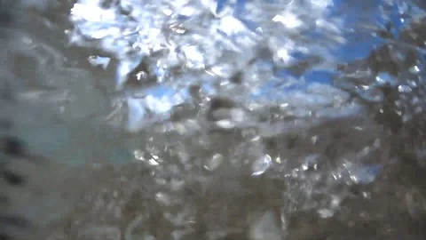 Ocean water lapping as camera goes in and out of water Stock Footage 129855926