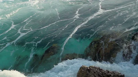 Ocean water moving through the rocks in slow motion. Stock Footage 169376839
