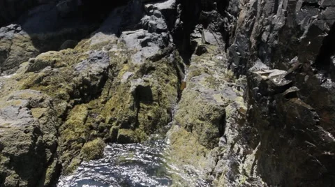 Ocean water pools around rocks Stock Footage 48341608