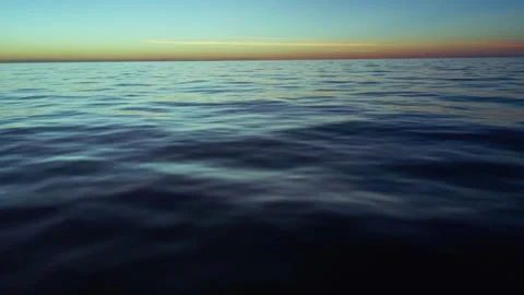 Ocean water surface during sunset or sunrise Vídeo Stock 331612079