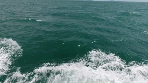 Ocean water wake behind a moving boat Video stock 336400066