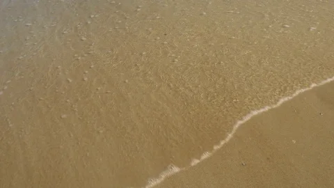 Ocean Water Washes Gently on the Sand Stock Footage 76366759