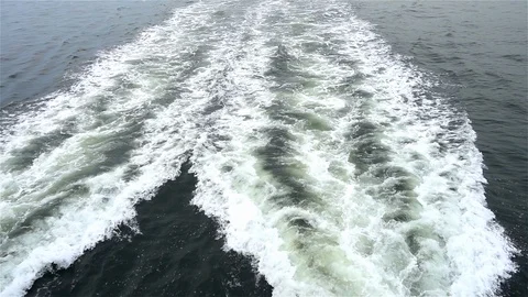 Ocean water wave ship trail with white foamy Stock Footage 128991305